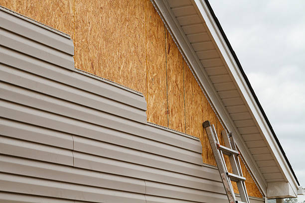 Professional Storm Damage Siding Repair technician working in Circleville, OH